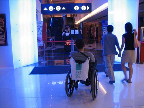 Wheelchair user outside the cinema