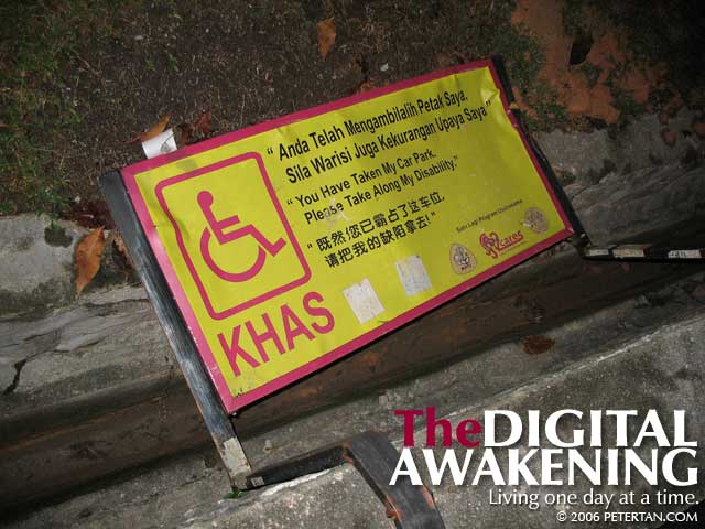 Knocked-down sign of accessible car park at SS2 Petaling Jaya