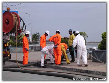 Cleaning crew at work in Gurney Drive after the Tsunami