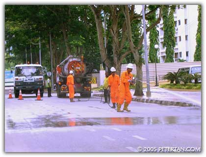 Cleaning crew clearing the mud from Gurney Drive after the tsunami
