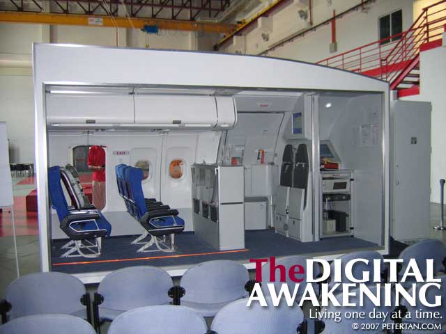 Mock-up of an aircraft cabin with a real Airbus A320 door for training at AirAsia Academy