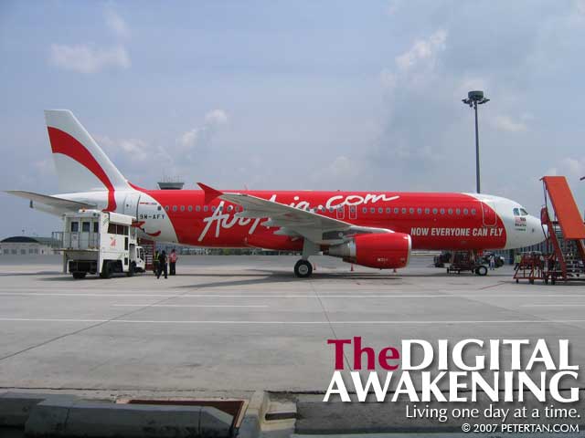 An ambulift similar to the one that AirAsia has purchased parked beside the newest aircraft in the fleet at LCCT-KLIA