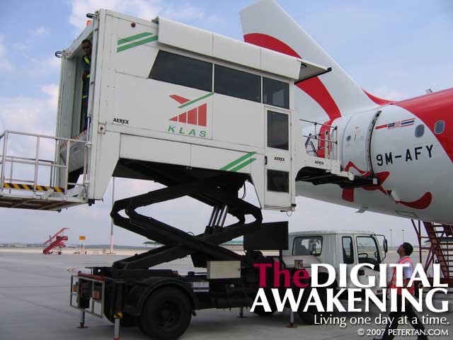 Ambulift docking beside AirAsia's newest Airbus 320