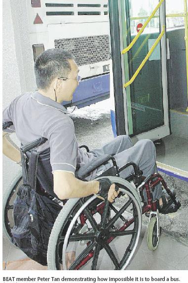 NST: Beat member Peter Tan demonstrating how impossible it is to board a bus