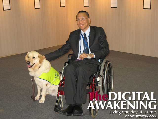 Posing with a guide dog at the 7th Disabled Peoples' International World Assembly