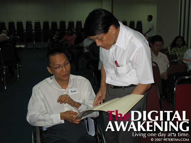 Peter Tan presenting to Dato' Dr. Teng Hock Nan the Memorandum Regarding Accessible Public Transport for Disabled Persons